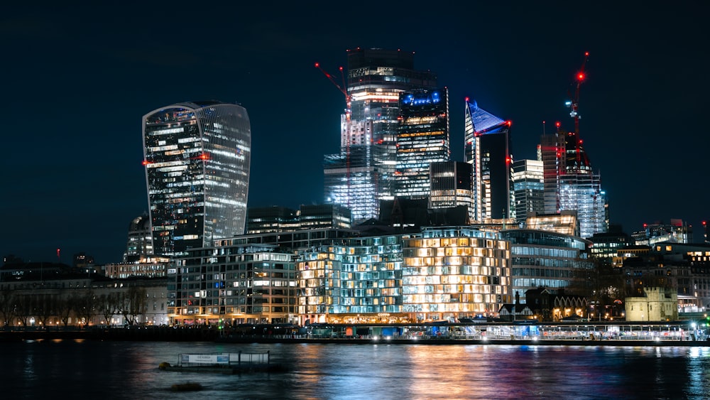 a city with tall buildings at night