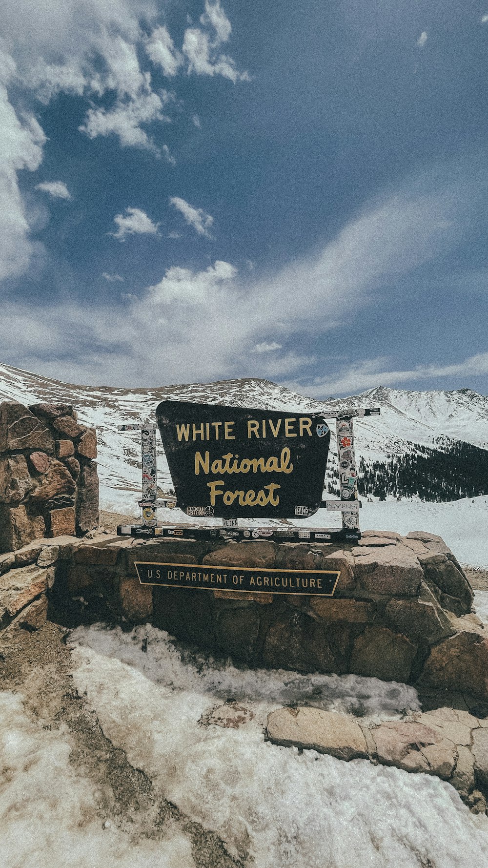 a sign on a rock