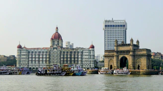 a body of water with boats and buildings along it