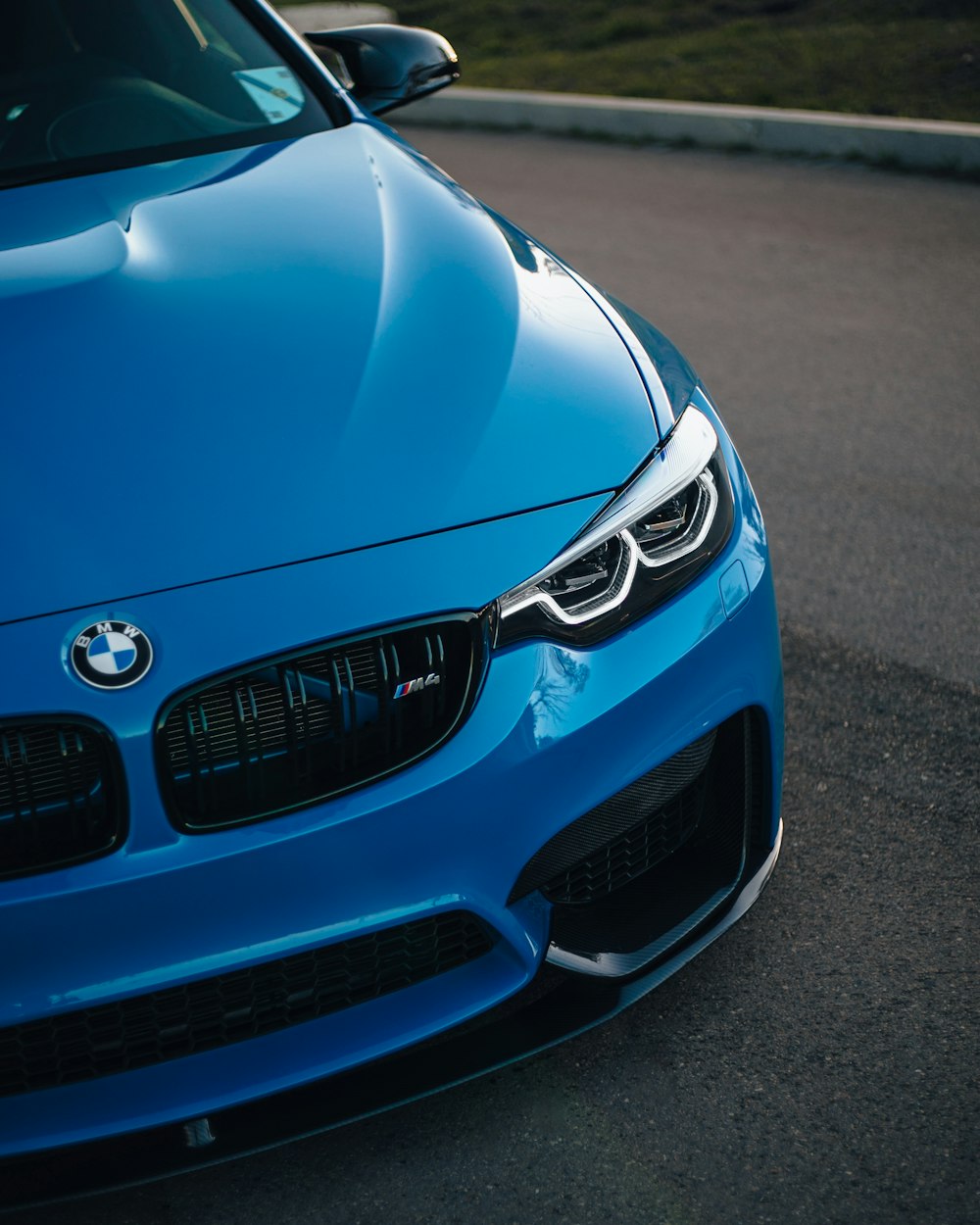 a blue car on a road