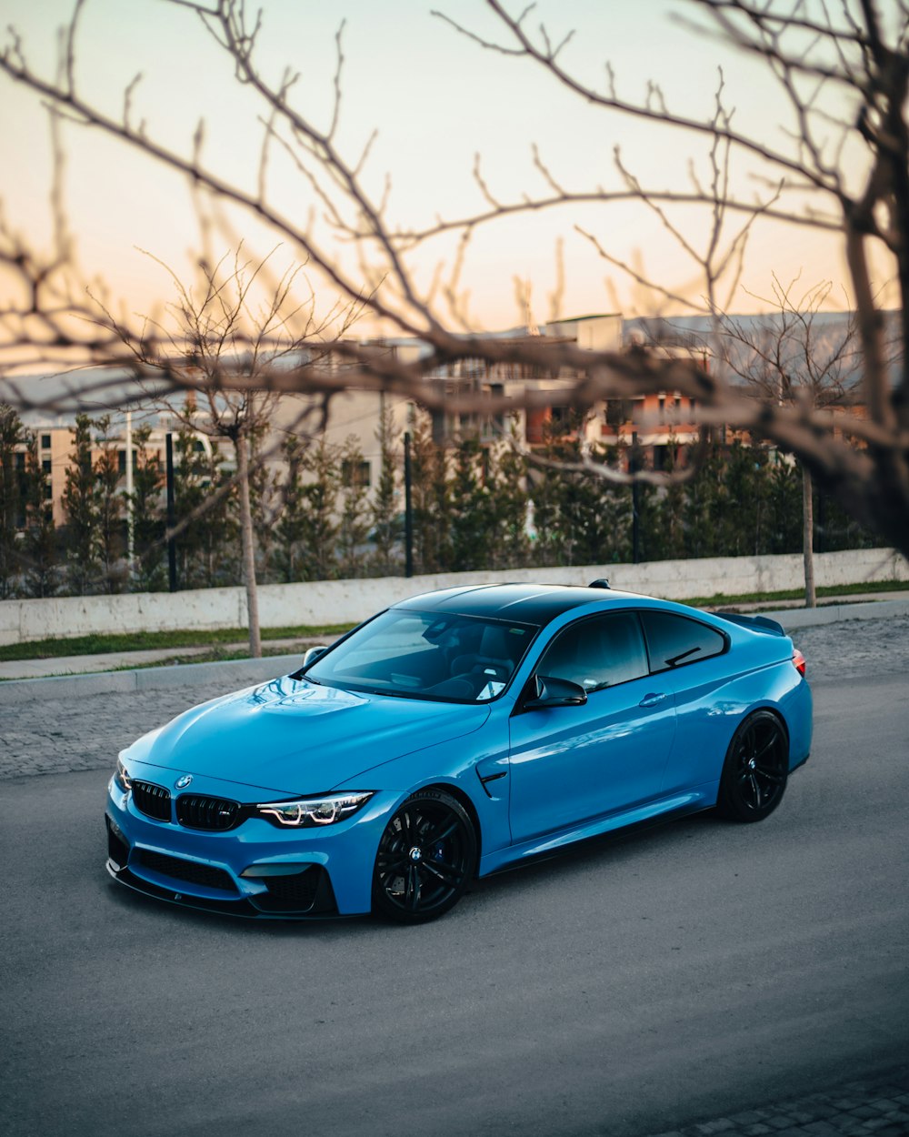 a blue car on a road