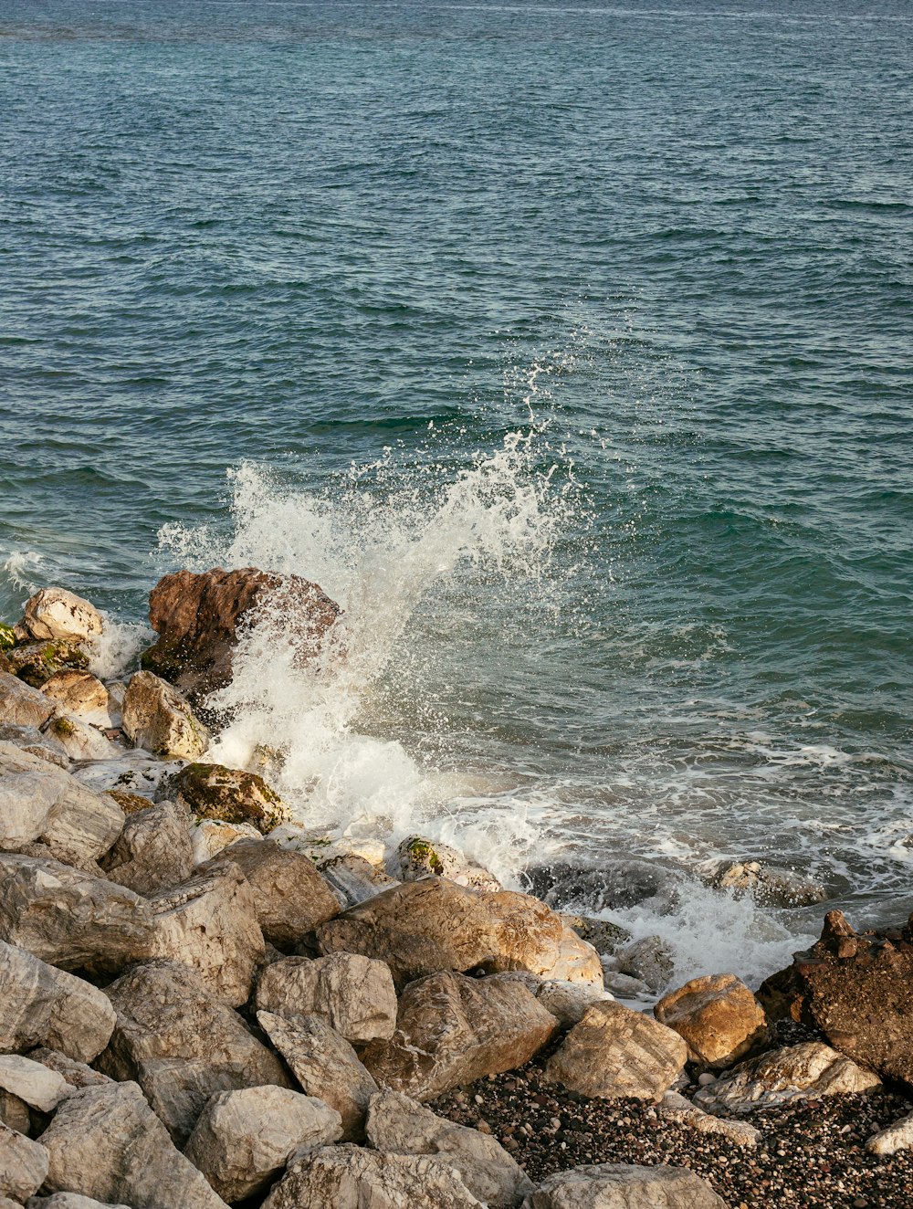 a rocky shore with waves crashing