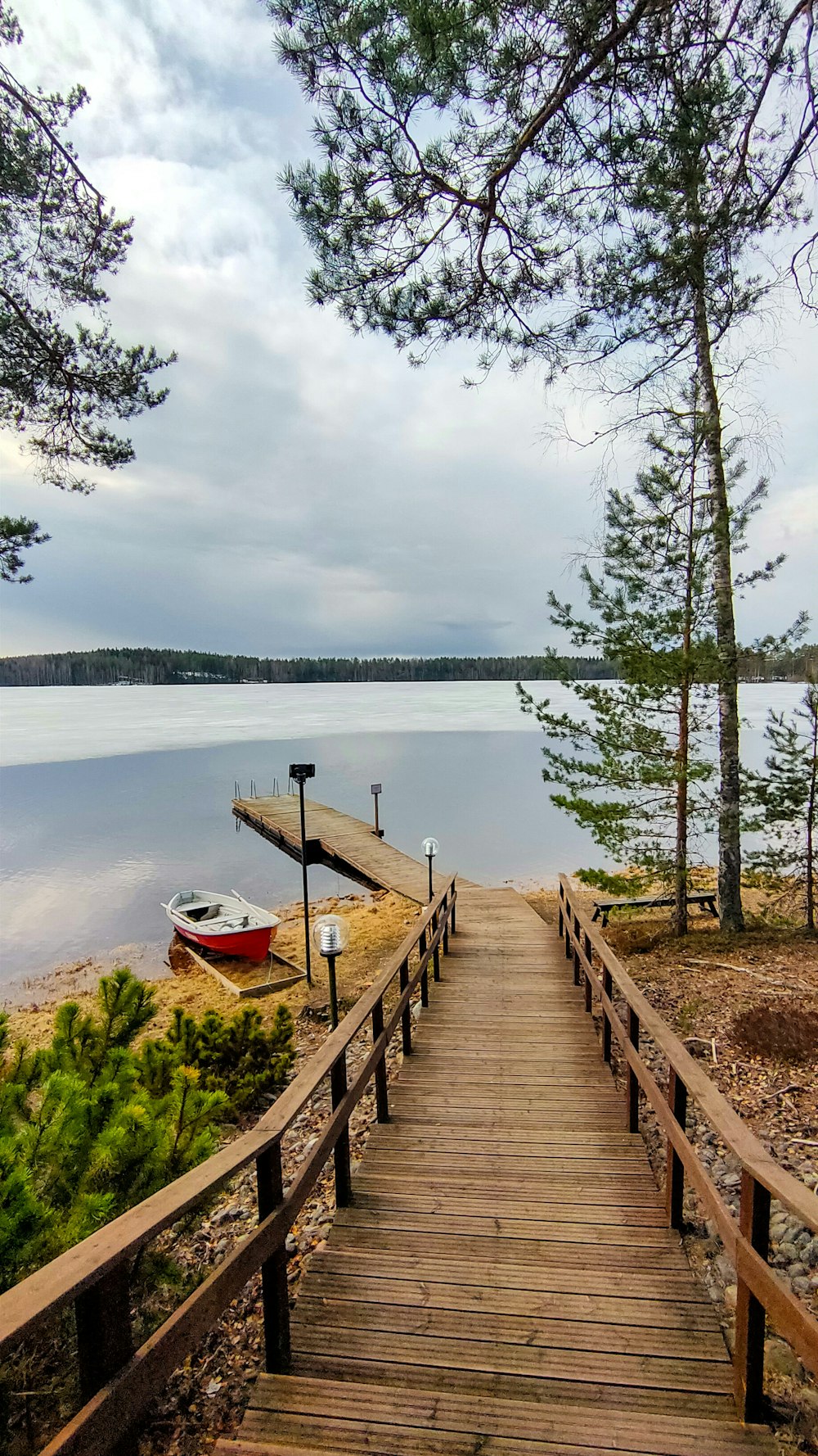 a wooden dock leading to a boat