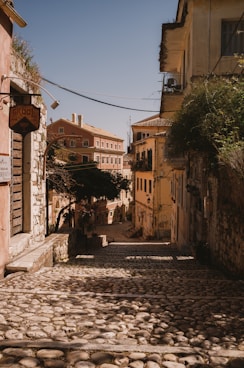 a cobblestone street with buildings on either side of it