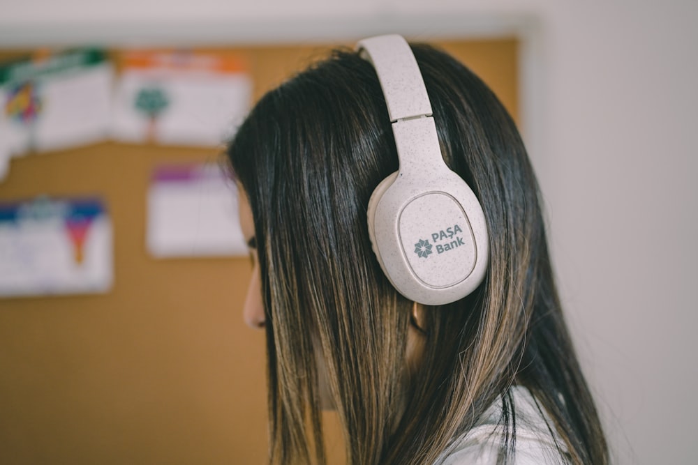 a woman with a white headphone on her head