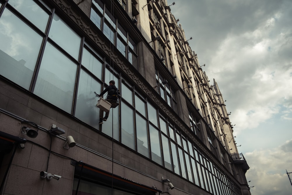 a person climbing a building