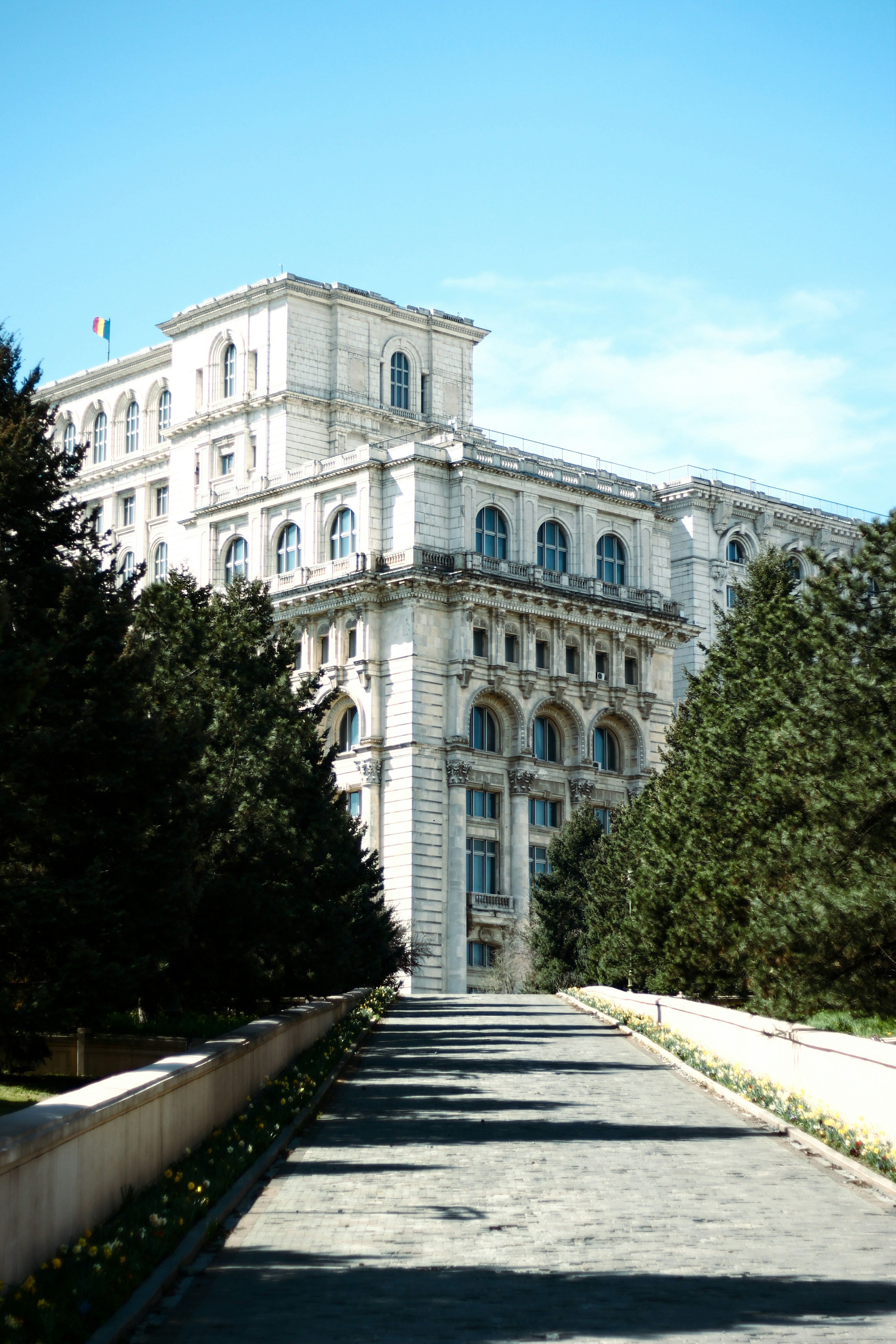 a large building with trees in front of it