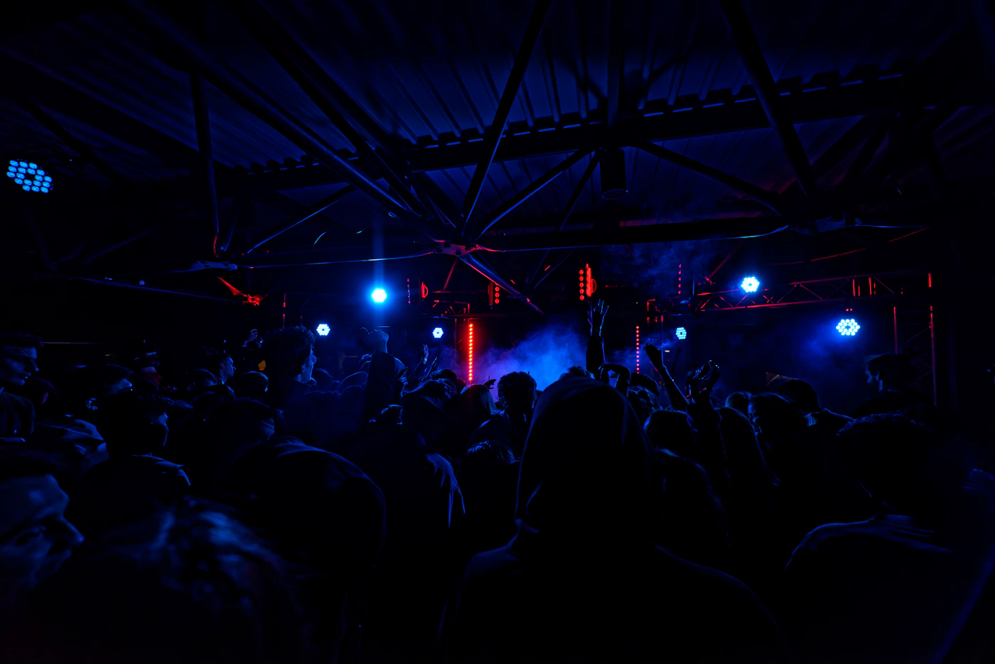 Concert audience under colourful stage lights