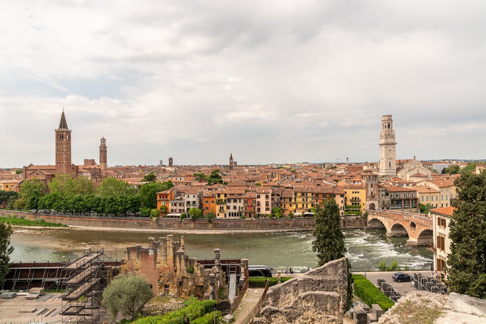 a river with a bridge and buildings along it