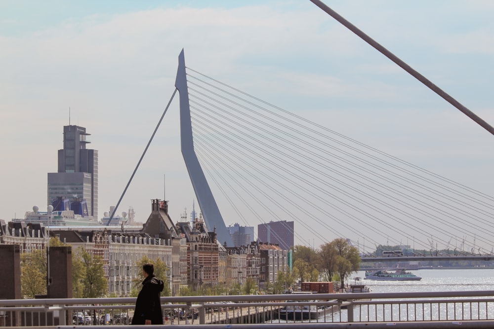 a person standing on a bridge