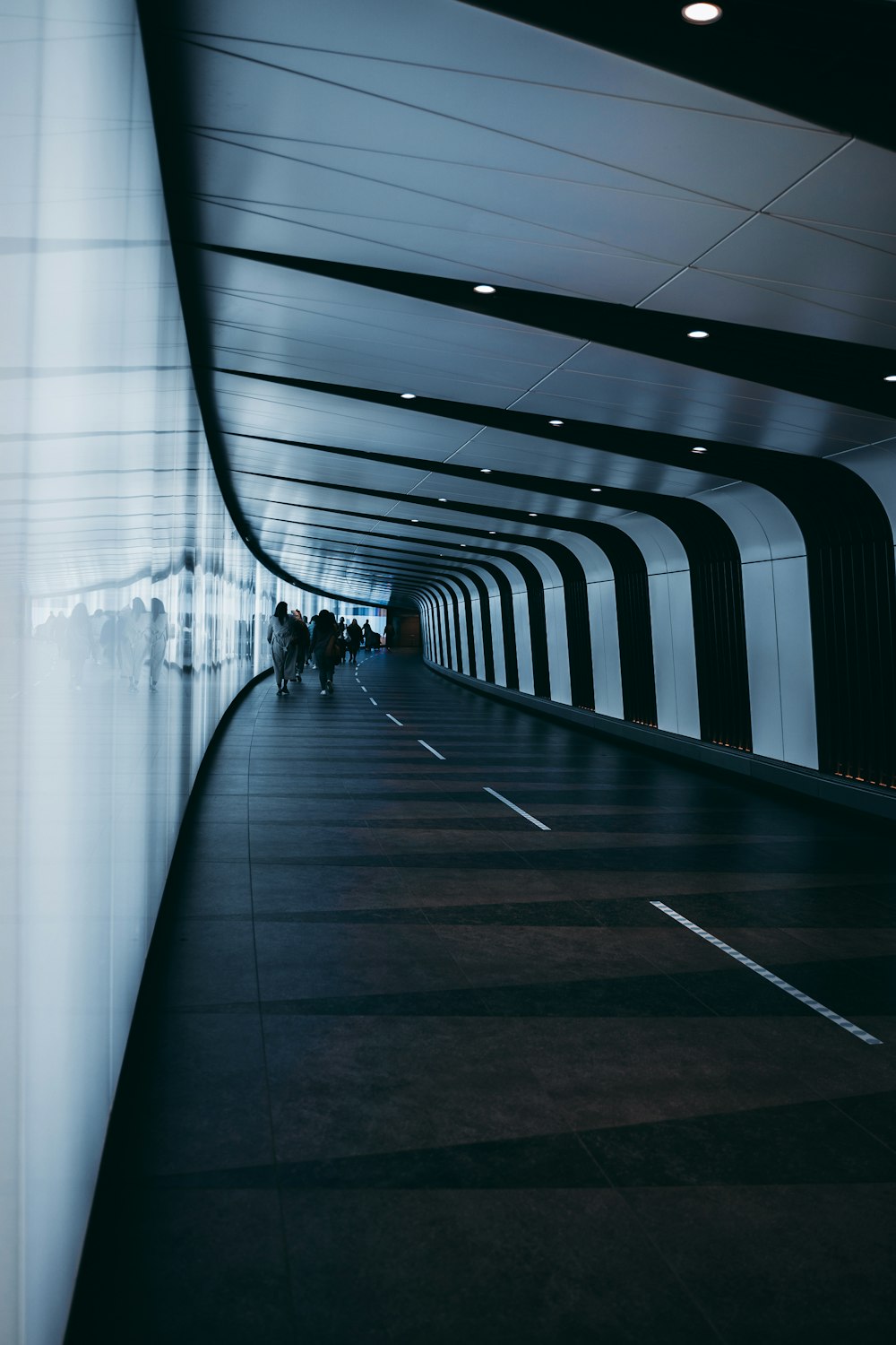 a group of people walking on a bridge