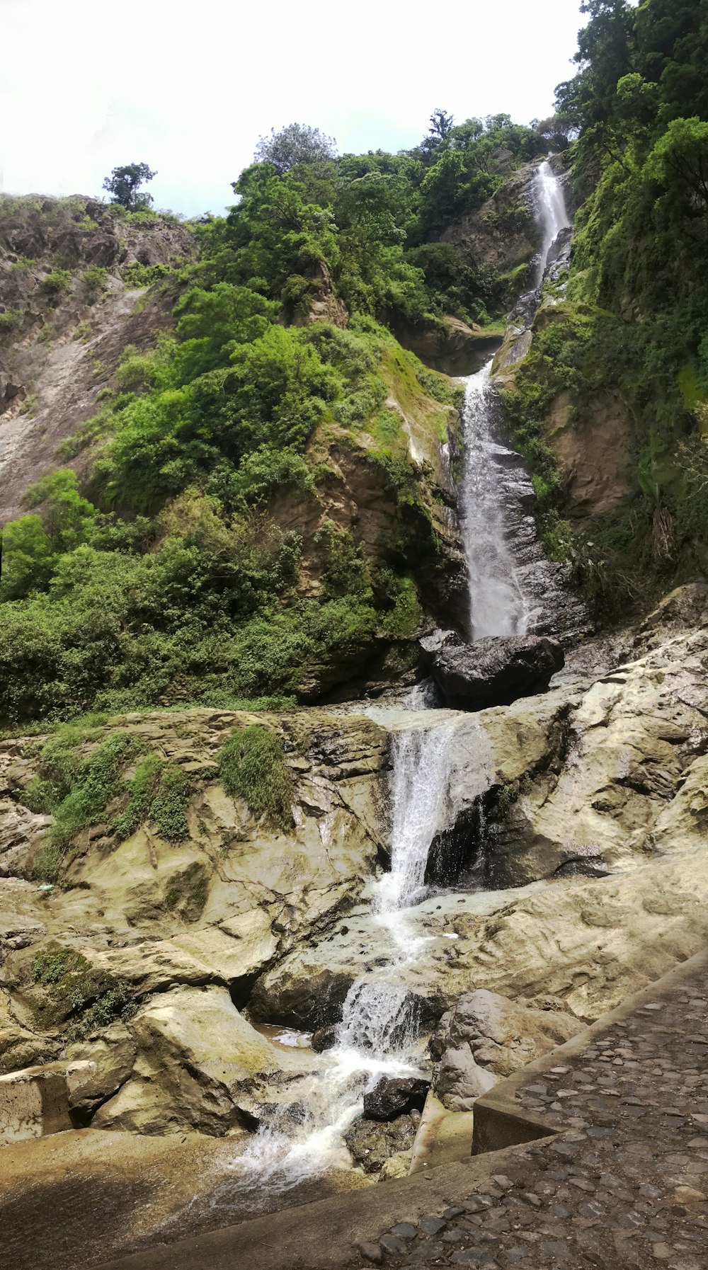 a waterfall in a rocky area