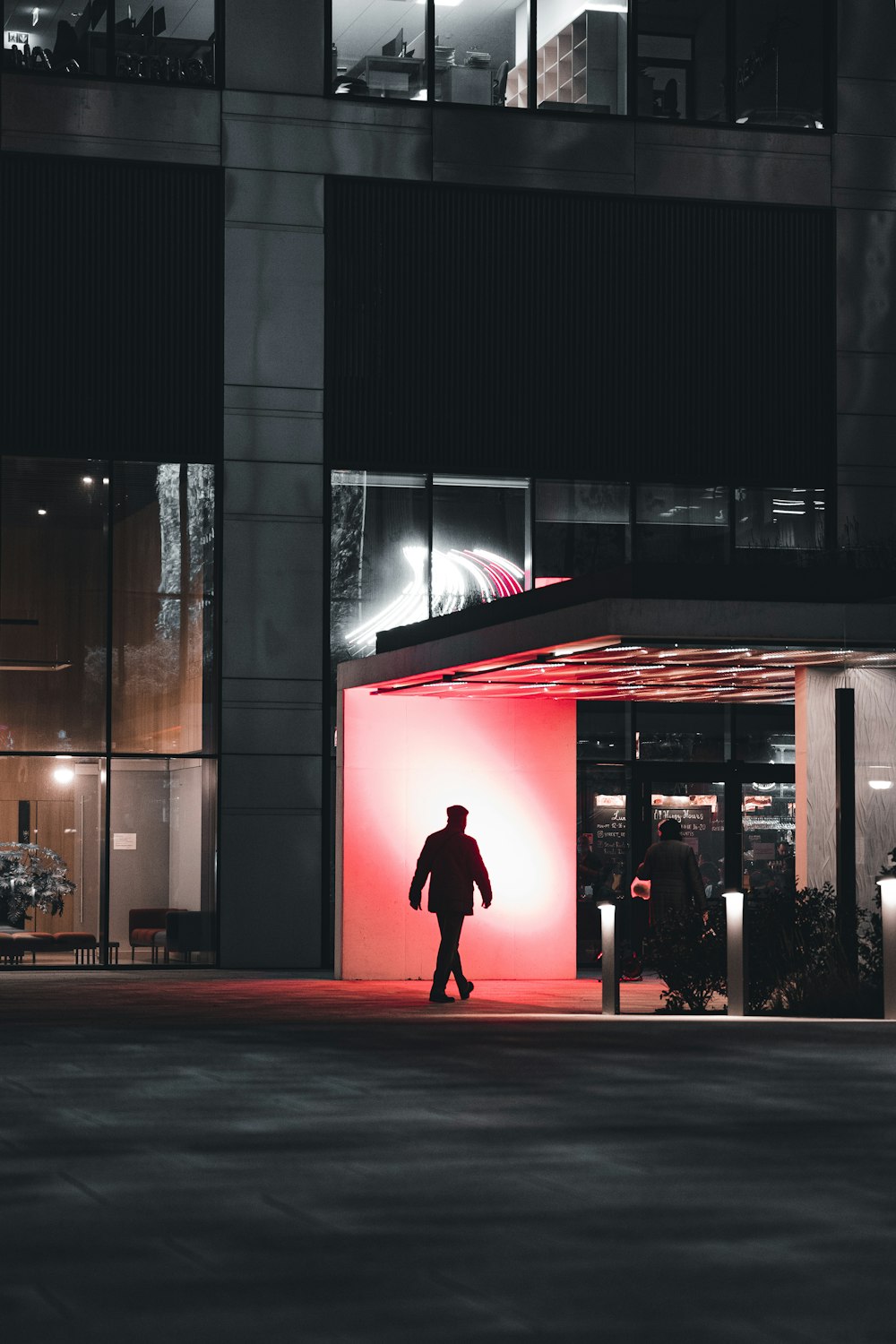 a person walking in front of a building