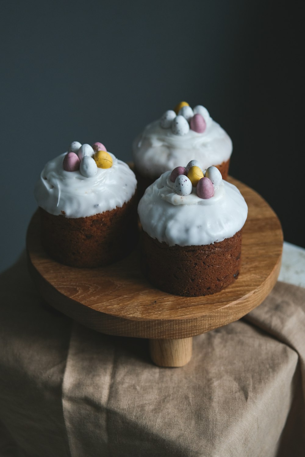 a couple of cupcakes with frosting and decorations