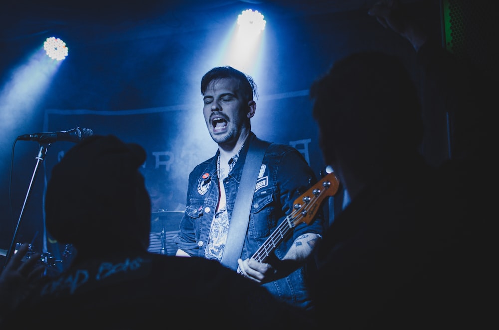 a man singing into a microphone