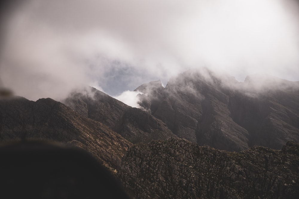 a mountain with clouds