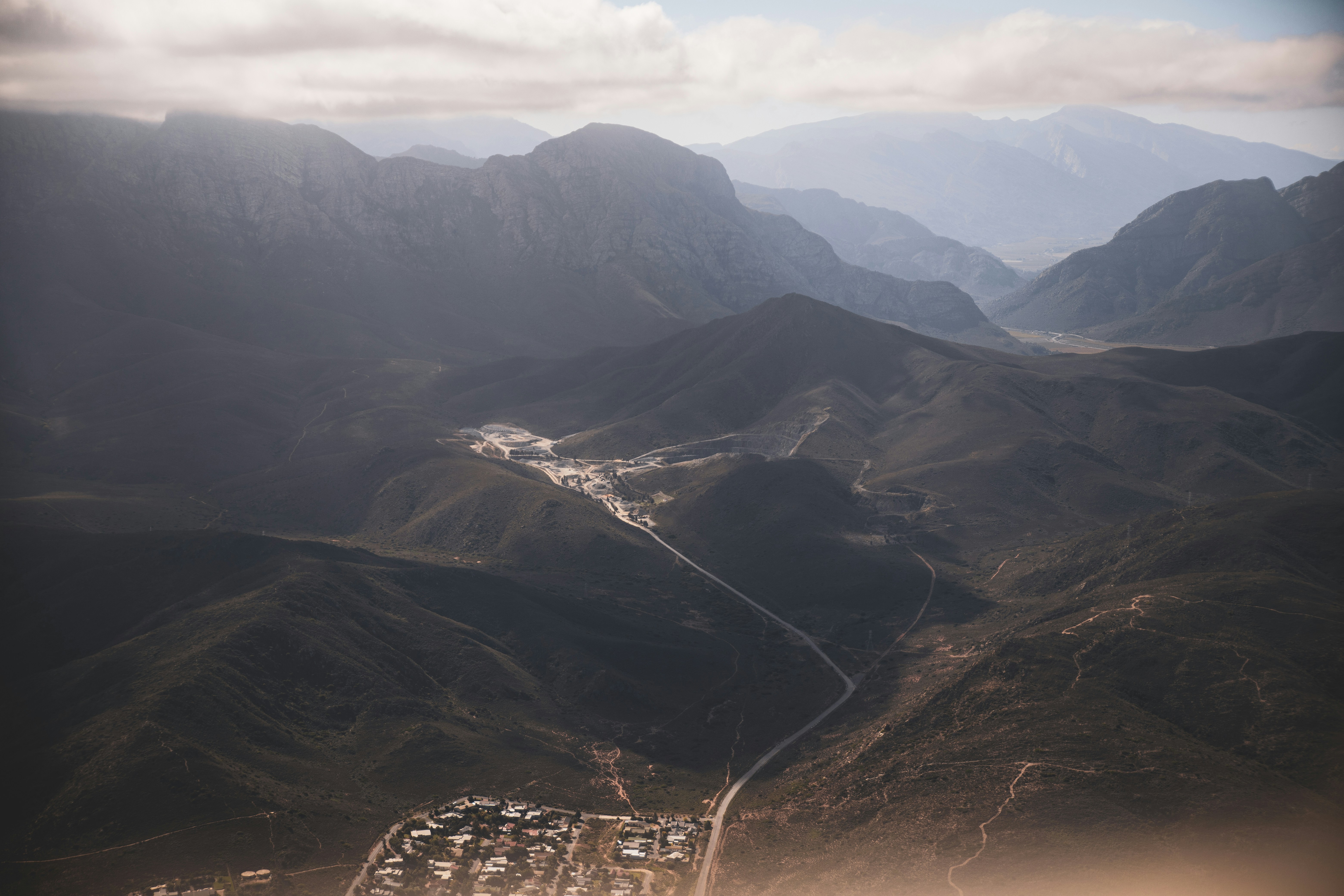 a valley with mountains in the background