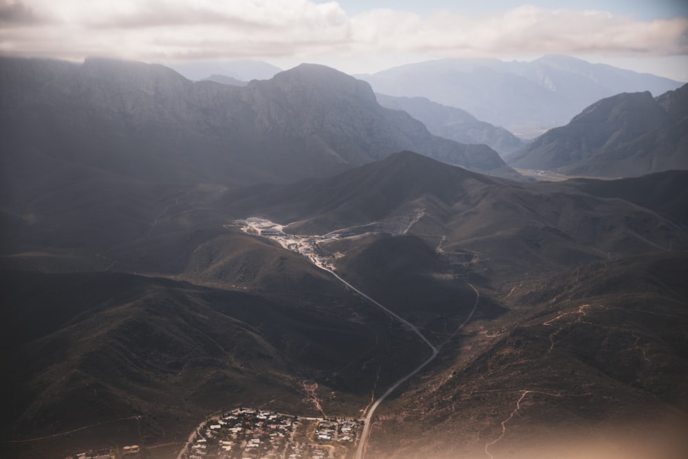 a valley with mountains in the background