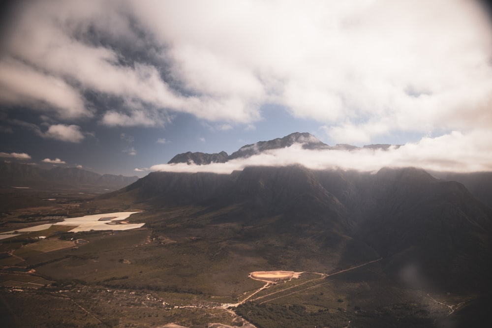 a valley with mountains in the background