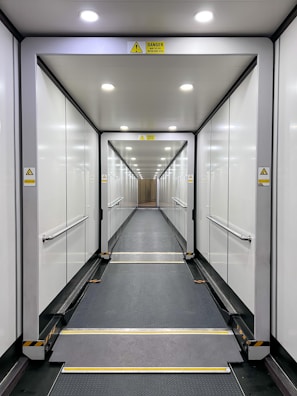 a long hallway with glass doors