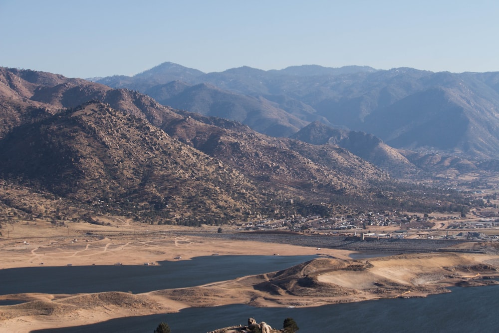 a valley with mountains in the background