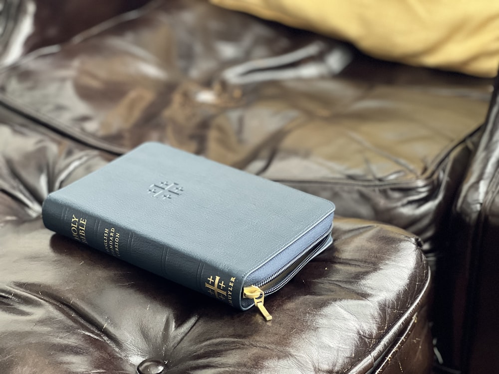 a book on a leather couch