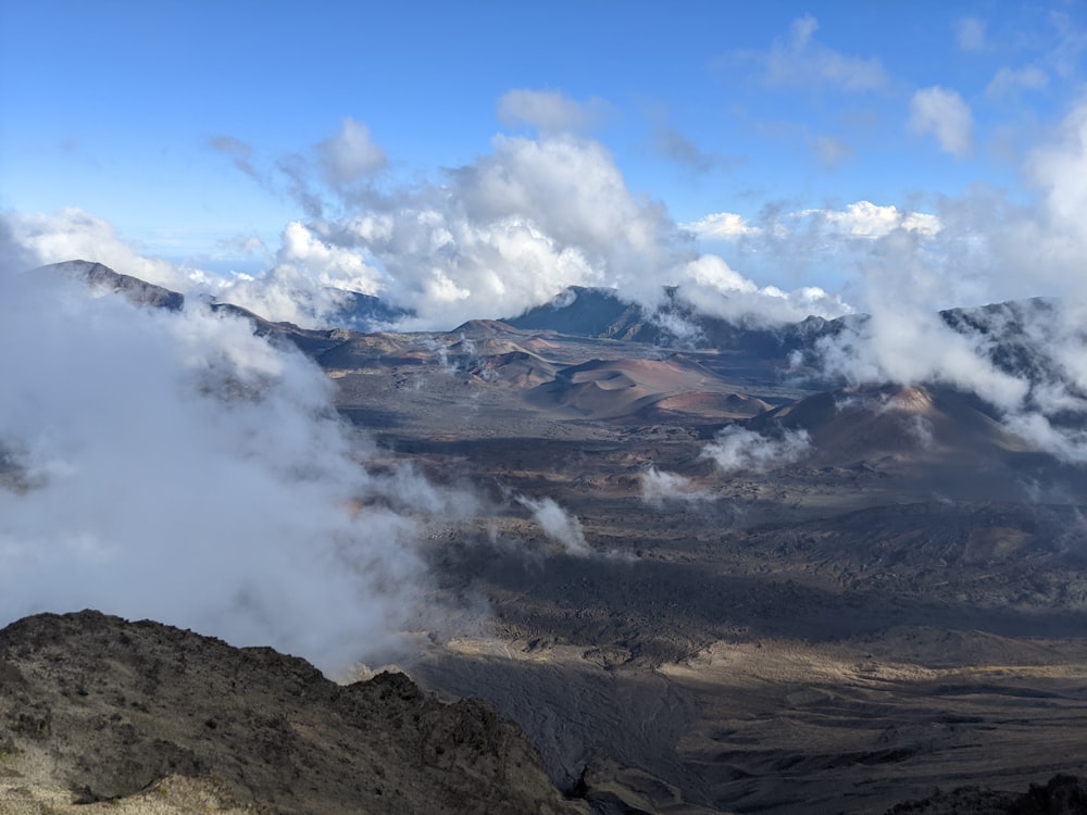 a mountain range with clouds