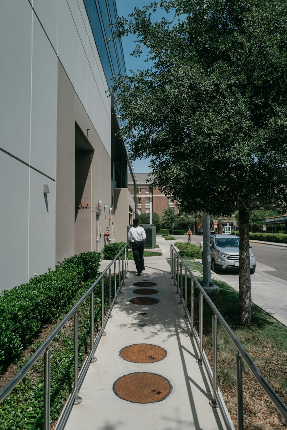 a person walking down a sidewalk