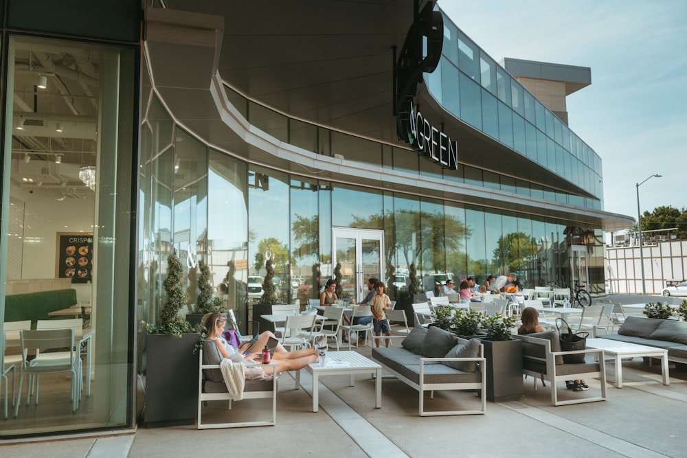 a group of people sitting outside a building