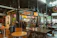 A vibrant Bolivian street food market bustling with colorful dishes and happy diners.