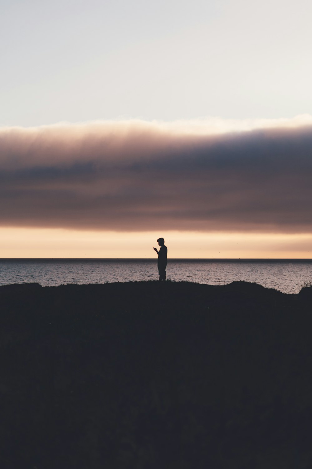 a person standing on a cliff