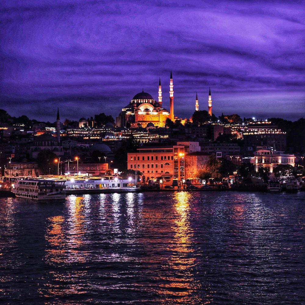 a city with a body of water in the foreground