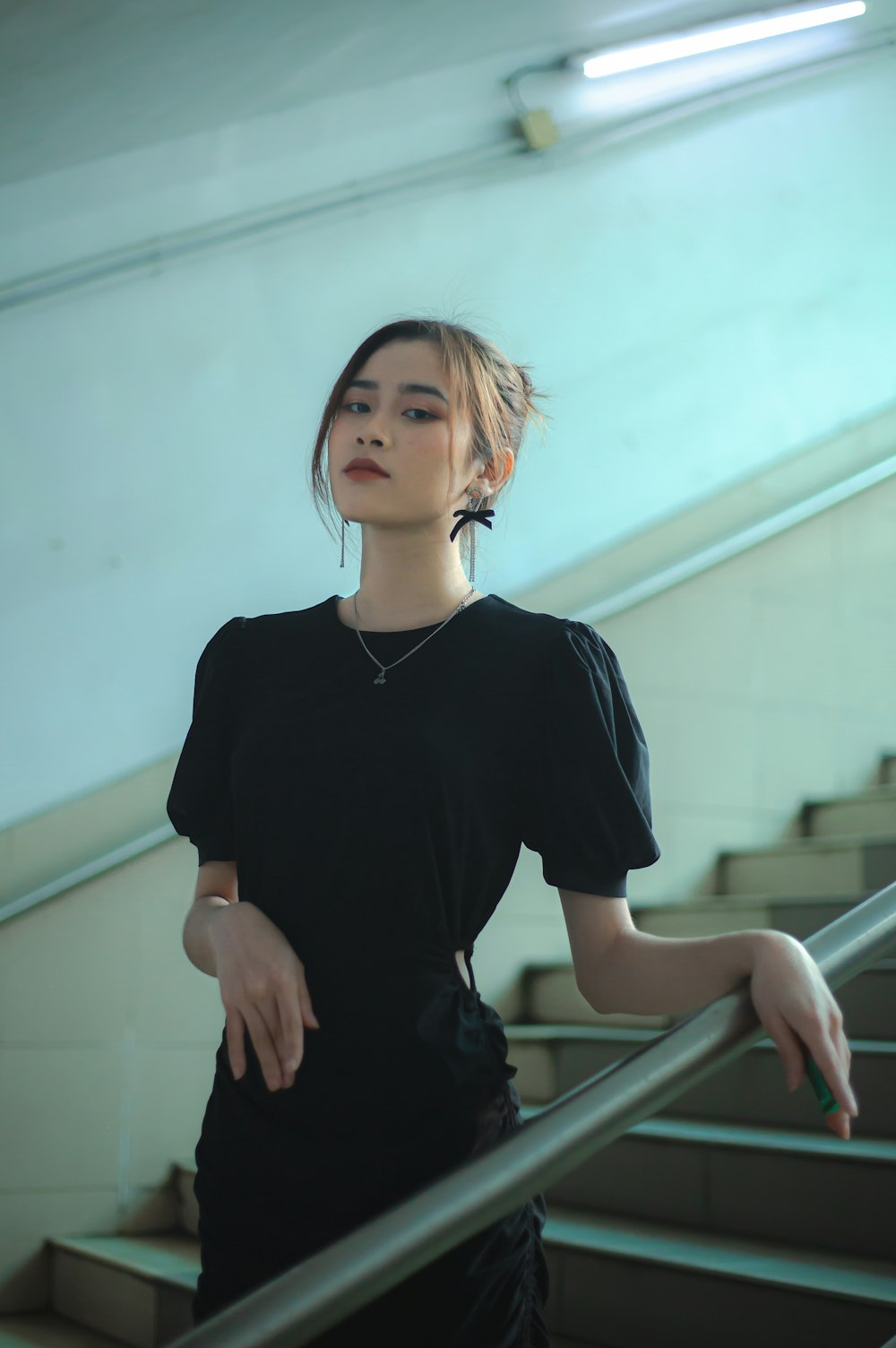 a person standing on a metal railing