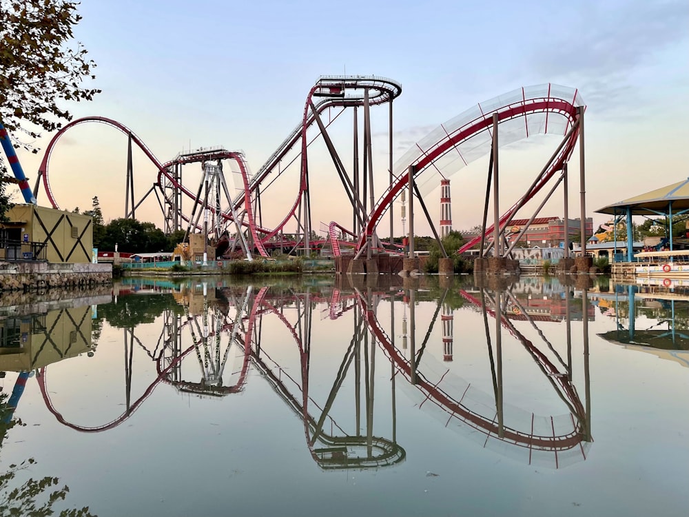 a red roller coaster in a park