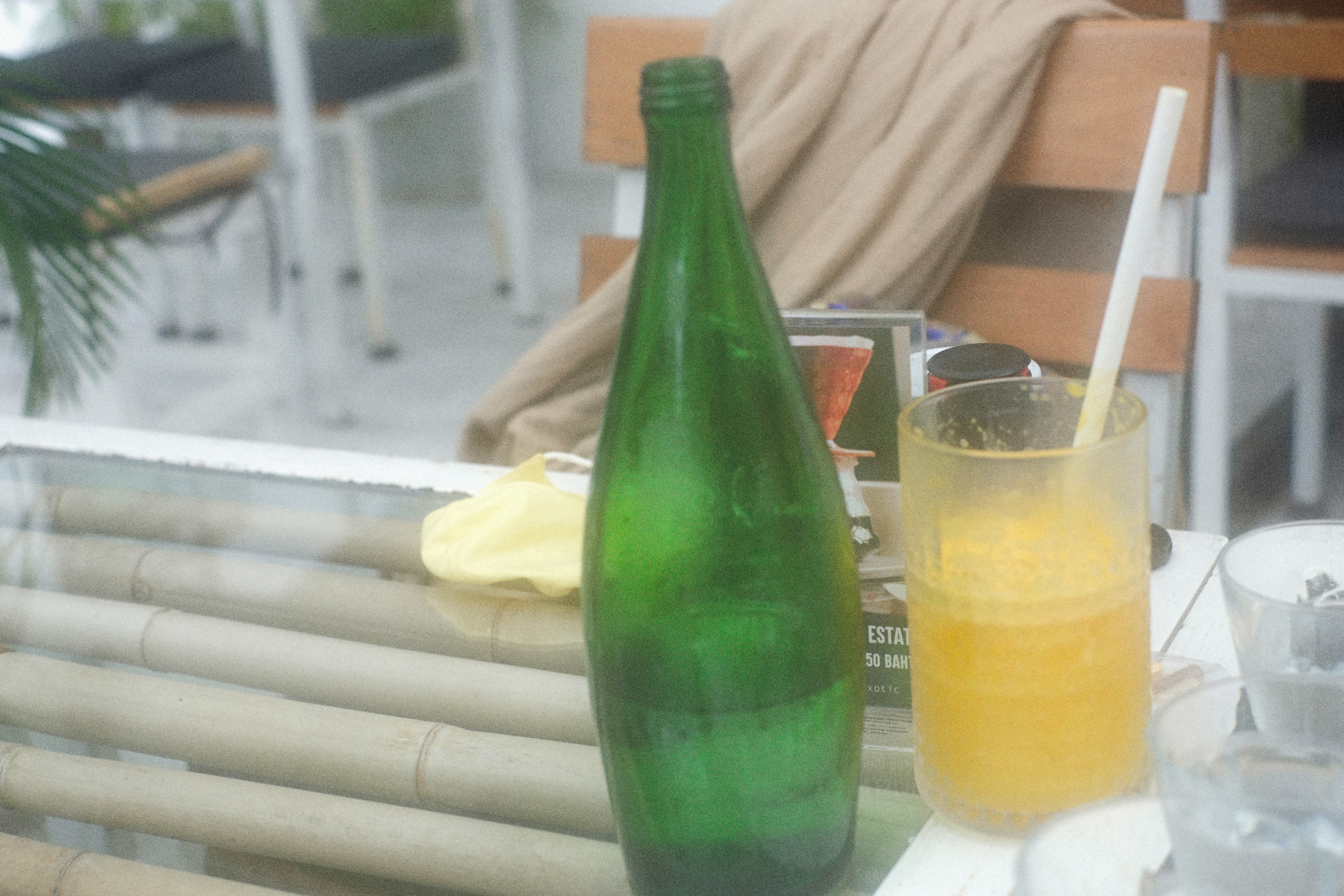 a bottle of sparkling wine next to a mimosa - best wine for mimosas