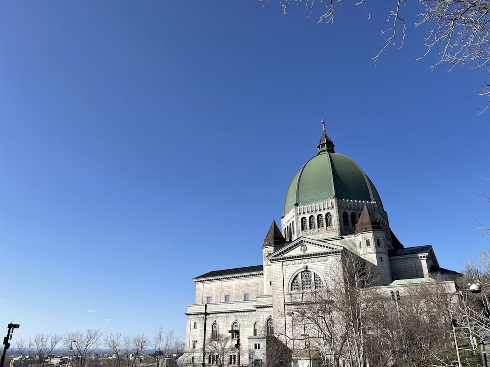 a large building with a green dome