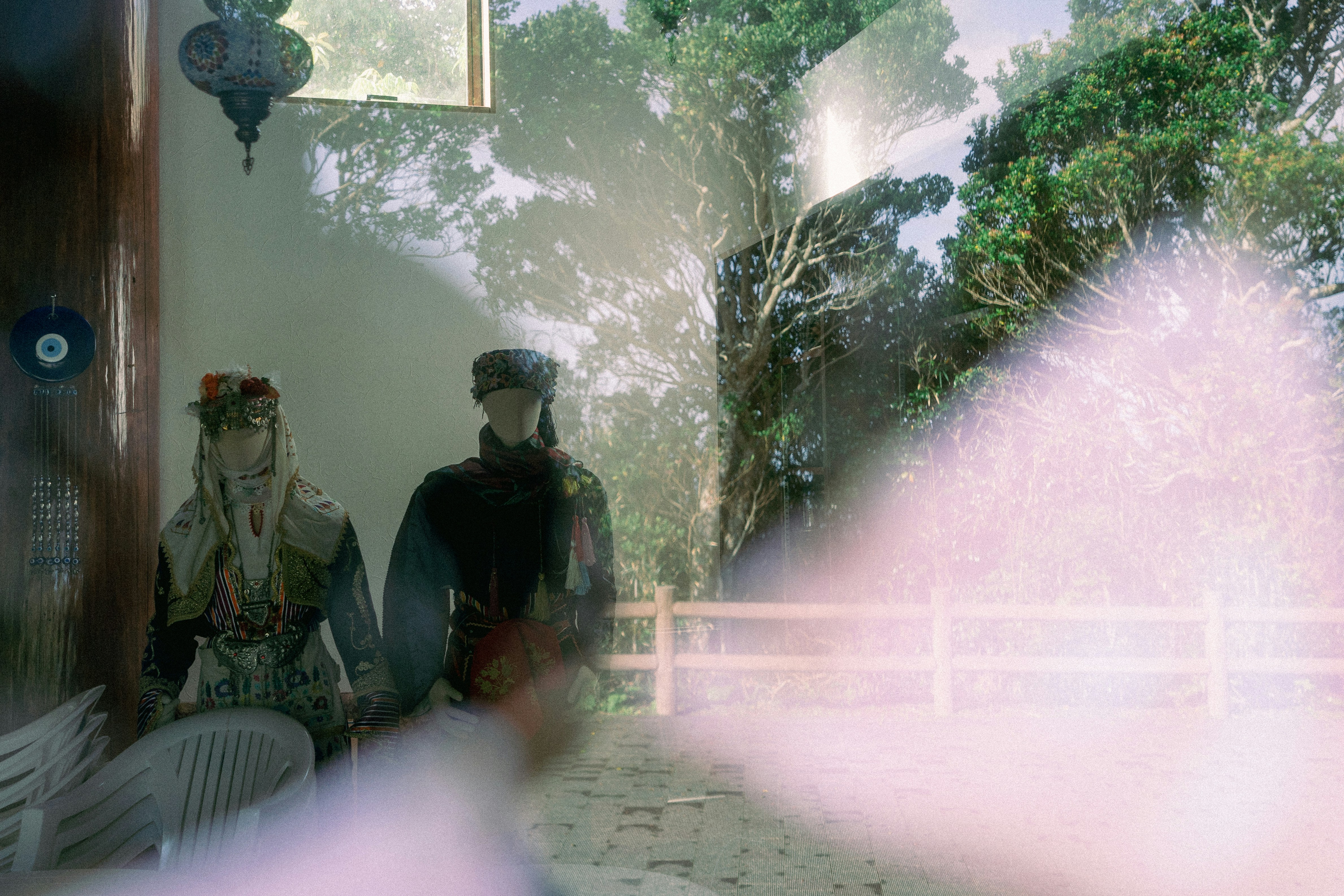 a couple of people sitting on a porch