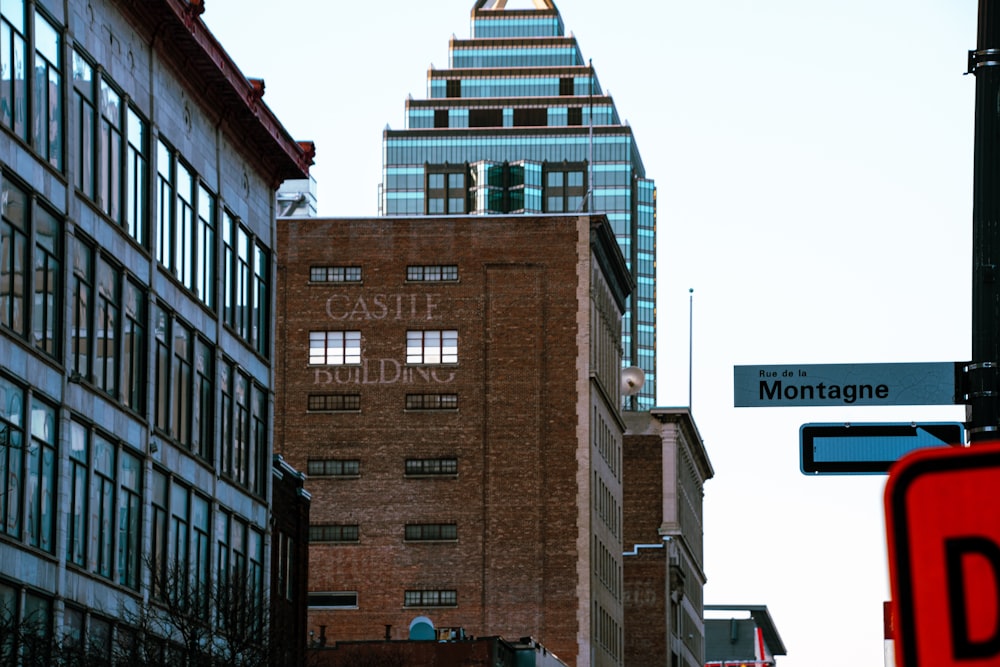 a street sign in front of a large building