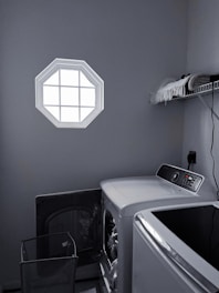 A laundry room showcasing a high-efficiency washing machine and dryer set.
