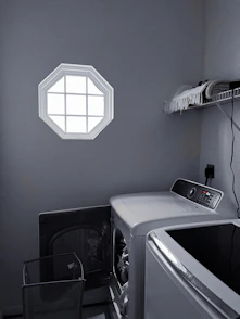 a microwave oven and a chair in a room