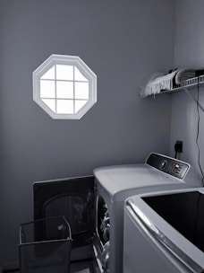 A laundry room showcasing a high-efficiency washing machine and dryer set.