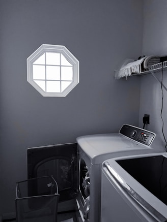 Energy-efficient front-loading washer in a bright laundry room setting.