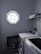 A bright laundry room showcasing a stylish washing machine and neatly folded towels.