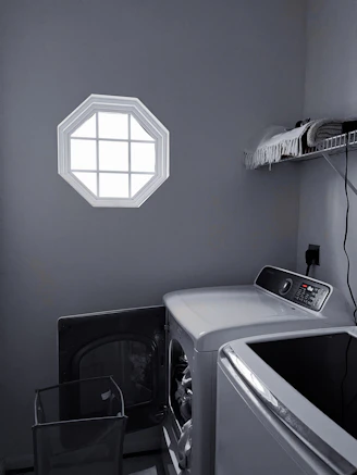 Shared laundry area with washer and dryer.