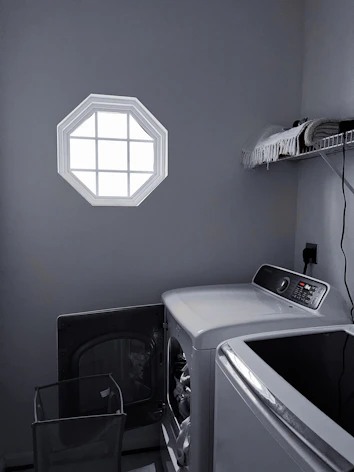 Shared laundry area with washer and dryer.