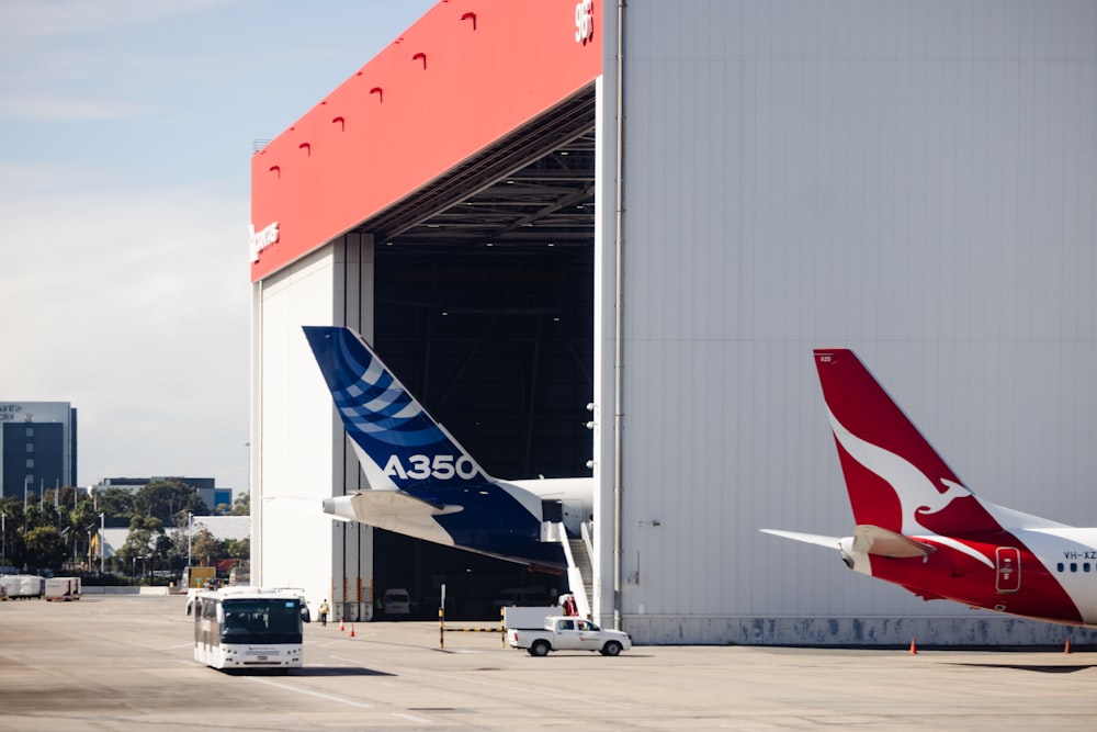 a plane is parked outside of a building