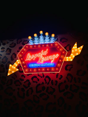 a sign with a light in the background