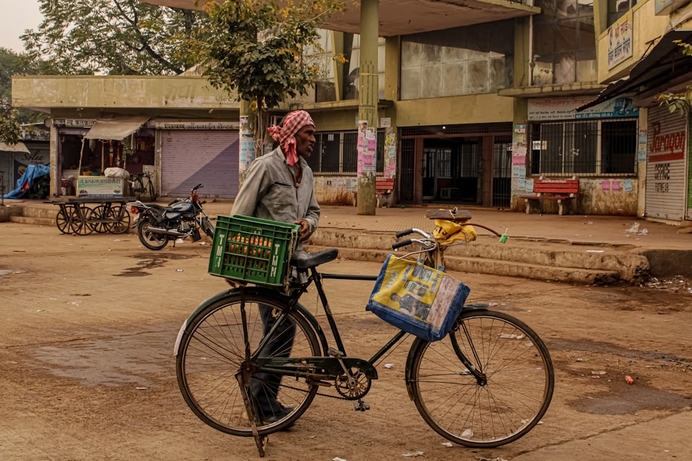 a person standing next to a bicycle