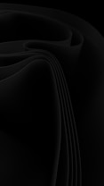Flowing black drapery with smooth curves and folds creating a sense of depth and texture. The image consists of fluid shapes and dark shades, suggesting elegance and mystery.