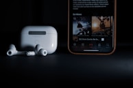 A lifestyle shot of a user enjoying music with Aobbow earbuds.